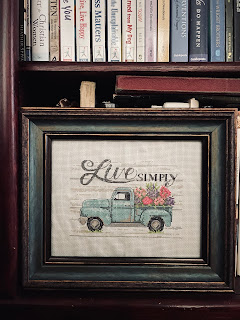 A cross stitch of a vintage truck